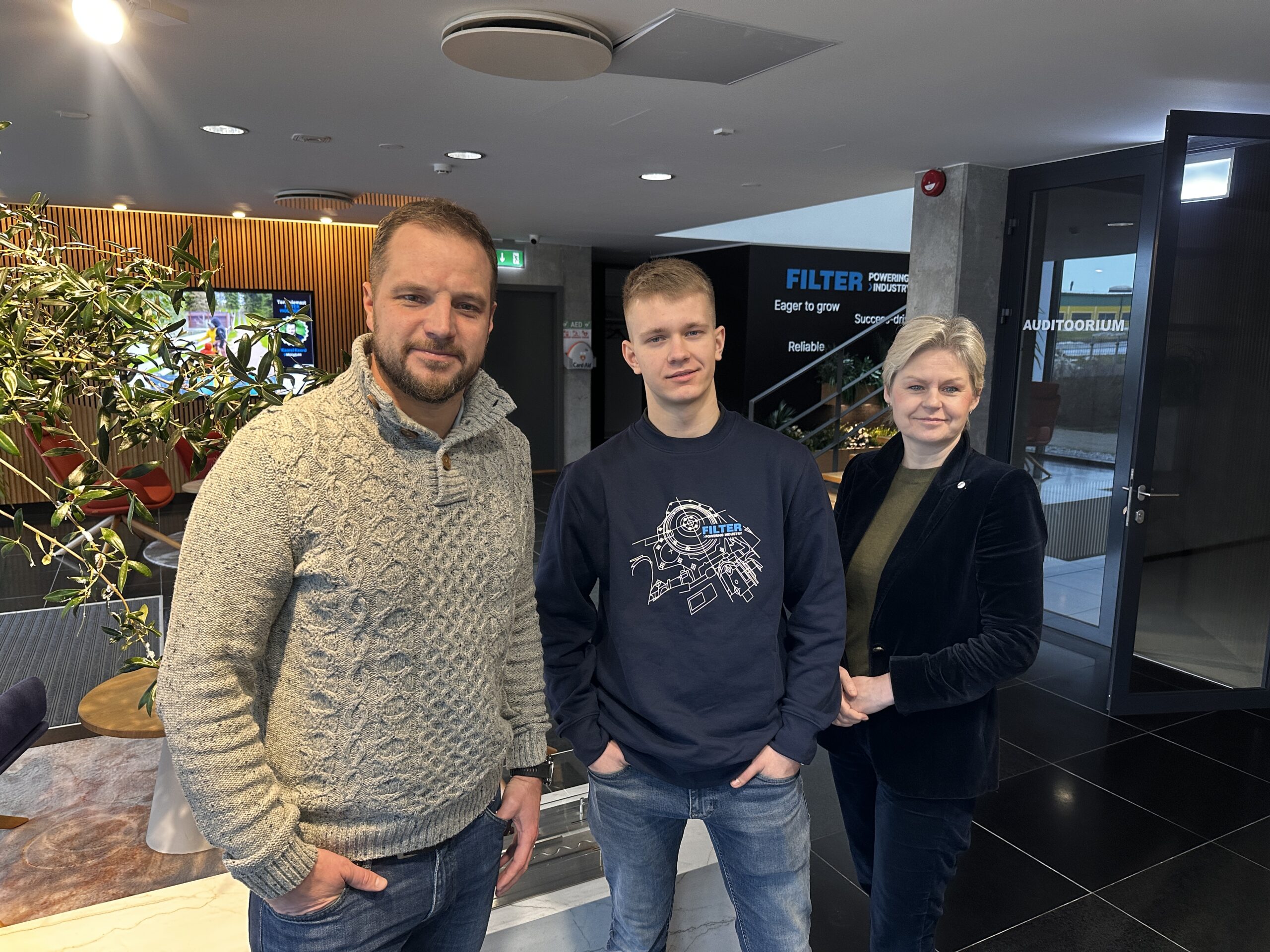 Merike, Martin Maasik, FILTER Service Development Manager, and Karl all smiling after finalizing the agreement for his upcoming traineeship with our maintenance team. 